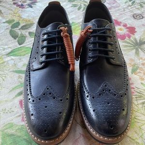Men’s Leather Wing-Tip Oxford by Clark’s.